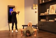Partner workout of the day (Image via Getty Images)